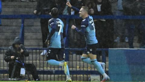 Cauley Woodrow celebrates