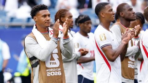 Ollie Watkins clapping the fans