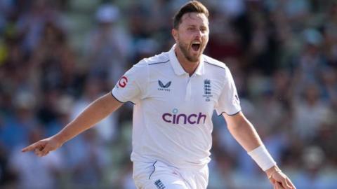 Ollie Robinson celebrates taking a wicket for England