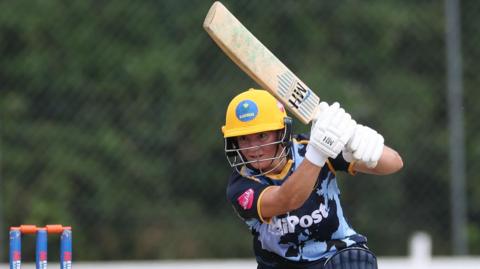 Daisy Mullan plays a shot