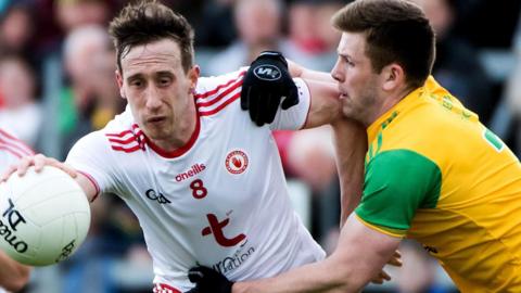 Colm Cavanagh is challenged by Donegal's Eoghan Ban Gallagher in the 2019 Ulster Football semi-final