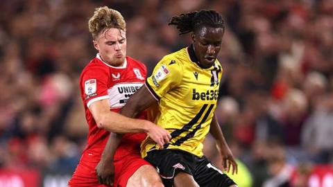 Middlesbrough's Tommy Conway and Stoke's Bosun Lawal battle for the ball