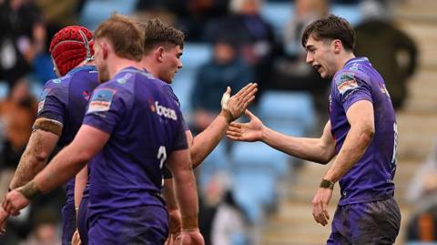 Exeter players celebrate