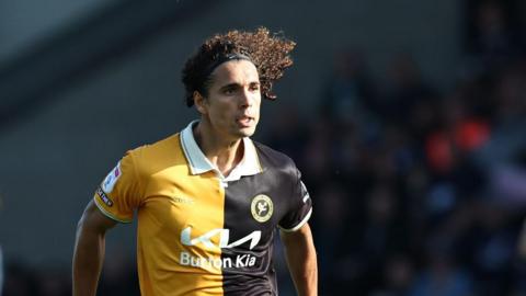 Charlie Webster playing in the amber and black of Burton Albion