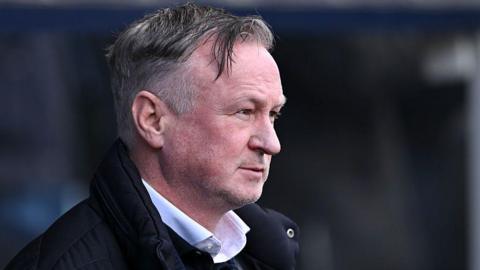 Michael O'Neill watching his Blackburn side at Millwall