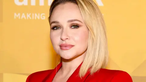 Hayden Panettiere smiles and looks at the camera