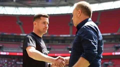 Crewe boss Lee Bell shakes hands with Crawley counterpart Scott Lindsey