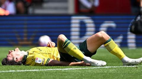 Kieffer Moore clutches his ankle after getting injured during Saturday's defeat at Southampton 