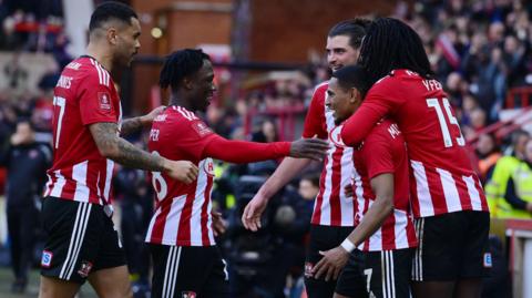 Exeter City celebrate scoring against Oxford United