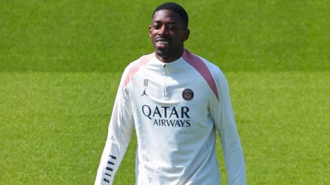 Ousmane Dembele smiling during Paris St-Germain training.