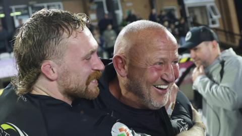 Steve Diamond (centre) being hugged by flanker Tom Gordon after a Newcastle Falcons victory