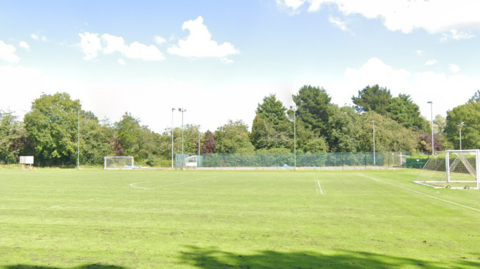 Coventry Copsewood football club with the floodlights around the pitch