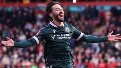 Josh Sheehan celebrates scoring for Bolton against Walsall 