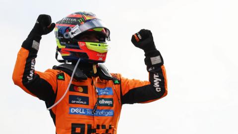 Oscar Piastri clenches both fists in celebration after winning the Dutch Grand Prix