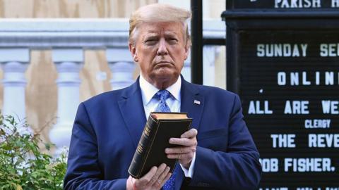 Trump holds a Bible in Washington in 2020