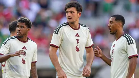 Manchester United players after loss to AC Milan