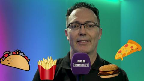 Dr Simeon Barber surrounded by fast food