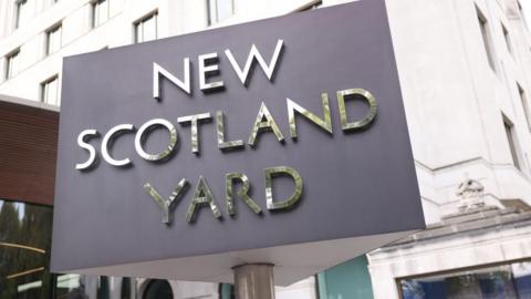New Scotland Yard sign outside Met Police HQ in London