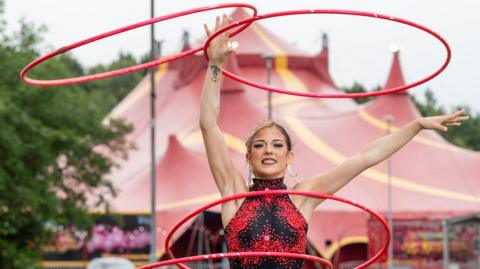 Maddie Cottle Dock performing with hula hoops for the Extreme Circus  show