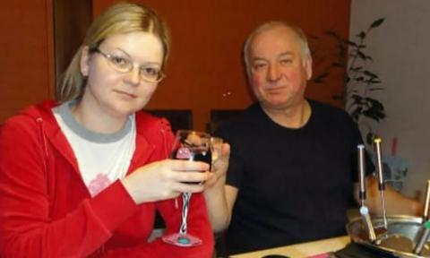 Sergei Skripal with his daughter drinking wine.