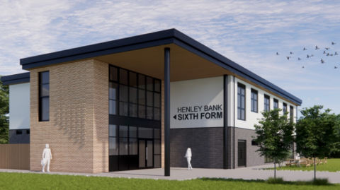 A computer generated image of what Henley Bank High School could potentially look like. There is a two-storey, square building surrounded by grass with a wall of panelled glass windows. There is a grey path leading up to the main glass door and to the right there are a few green trees and wooden benches.