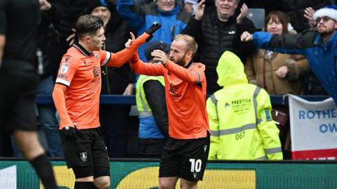 Josh Windass celebrating his goal with Sheffield Wednesday captain Barry Bannan