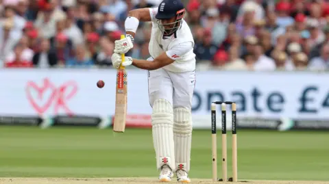 England opener Emilio Gay plays a shot