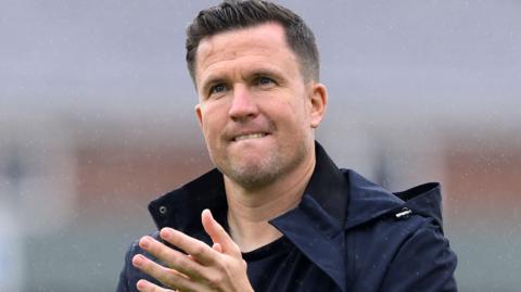 Gary Caldwell claps supporters