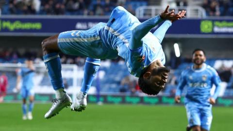 Kaine Kesler-Hayden does a double back-flip in celebration at scoring for Coventry City