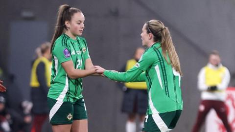 Kascie Weir (left) comes on for Simone Magill (right) in Gdansk