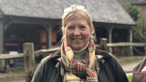 Sarah Farquhar at Acton Scott, wearing a tartan scarf and wax jacket