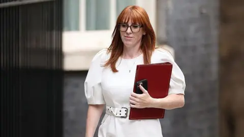 Burnham and wife Frankie outside No 10