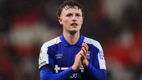Ipswich Town striker Nathan Broadhead applauds fans