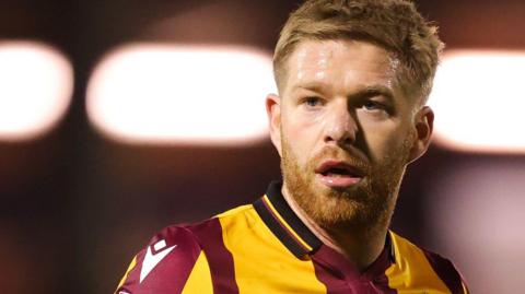 Adam Clayton in action for Bradford City in 2023