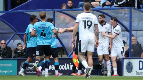 Tranmere and Crewe players clash at Prenton Park