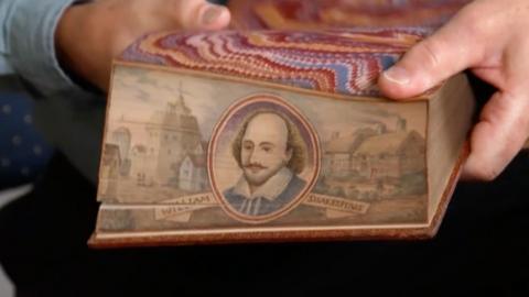 An illustration of William Shakepeare on the side of a book
