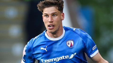 Sil Swinkels in action for Chesterfield wearing their blue home shirt
