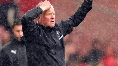 Chris Wilder in the rain