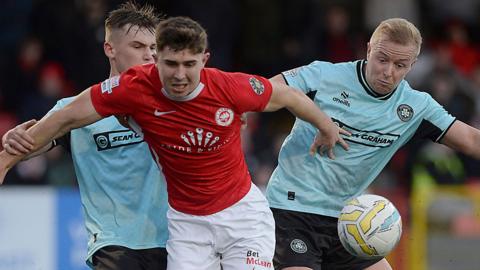 Action from Larne v Cliftonville