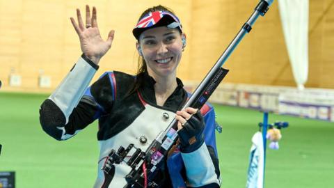 Seonaid McIntosh celebrates her bronze medal at the shooting World Championships