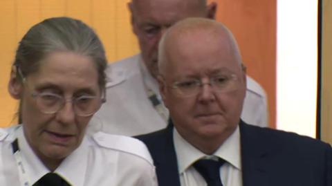 Peter Murrell is led into court by guards