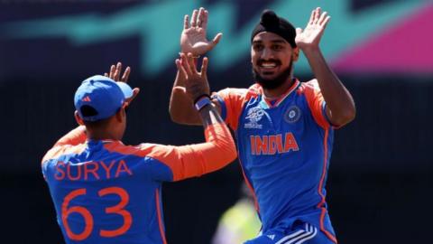 India bowler Arshdeep Singh (right) celebrates taking a wicket