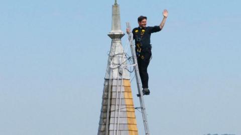 Father Steven Emerson climbed the spire of St Andrew's in West Tarring.