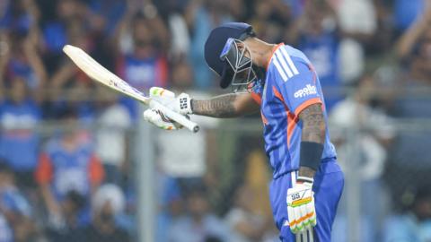 Suryakumar Yadav bows after hitting a half-century
