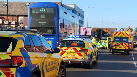 Police and ambulance crews on St Helens Road in Bolton