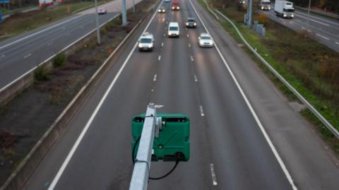 Green Highway England ANPR camera monitoring traffic flow on British motorway M1