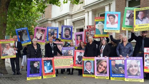 Victims' families gathered outside Chelmsford Civic Centre on the opening day of the Lampard Inquiry