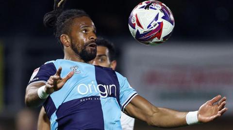 Wycombe Wanders player Garath McCleary chests the ball.