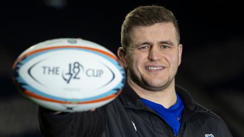 Scott Cummings poses for photos at Scotstoun