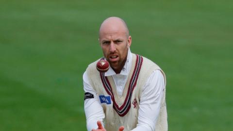 Jack Leach having had the ball thrown to him for Somerset